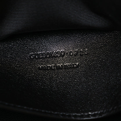 Black leather stamp with product code and "MADE IN ITALY" text