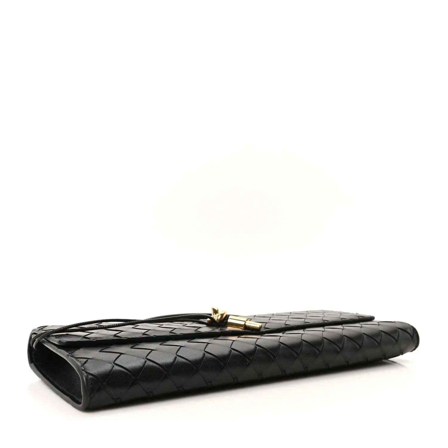 Black woven leather clutch with gold clasp and curved side edge