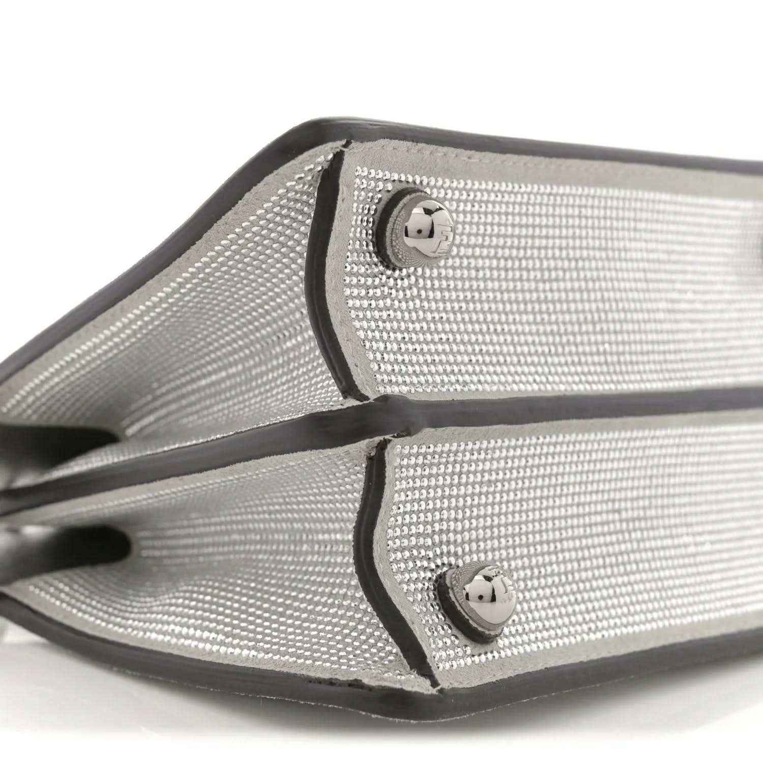 Silver crystal satchel corner with black trim and snap hardware