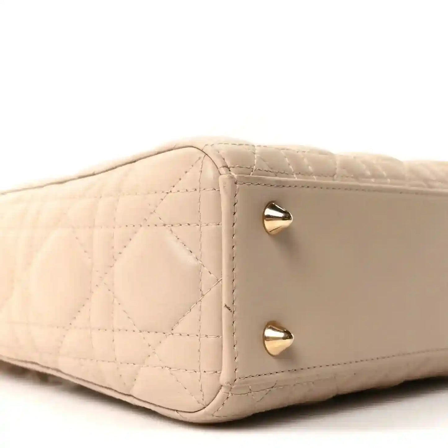 Beige quilted mini handbag side with gold corner studs