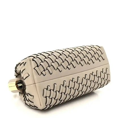 Ivory woven leather clutch with gold-tone ring clasp and structured top