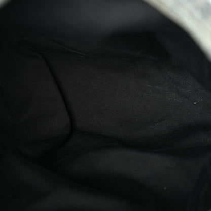 Black fabric lining inside denim puffer satchel