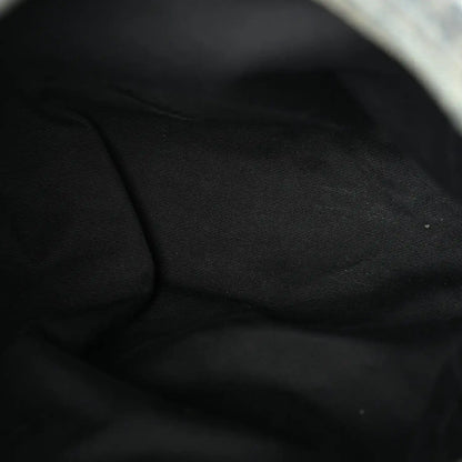 Black fabric lining inside denim puffer satchel