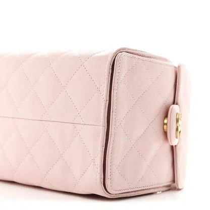 Chanel light pink quilted caviar small shoulder handbag side with gold turn-lock