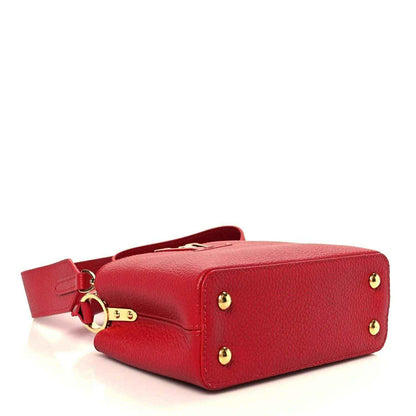 Louis Vuitton scarlet leather mini handbag with structured body and gold-tone feet