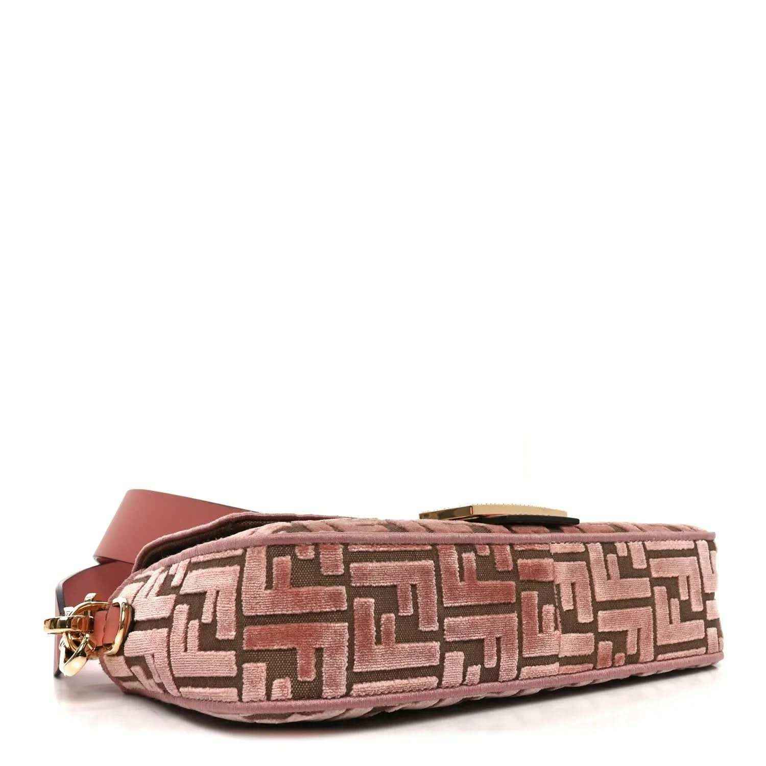 Pink velvet jacquard baguette bag bottom corner with gold-tone hardware