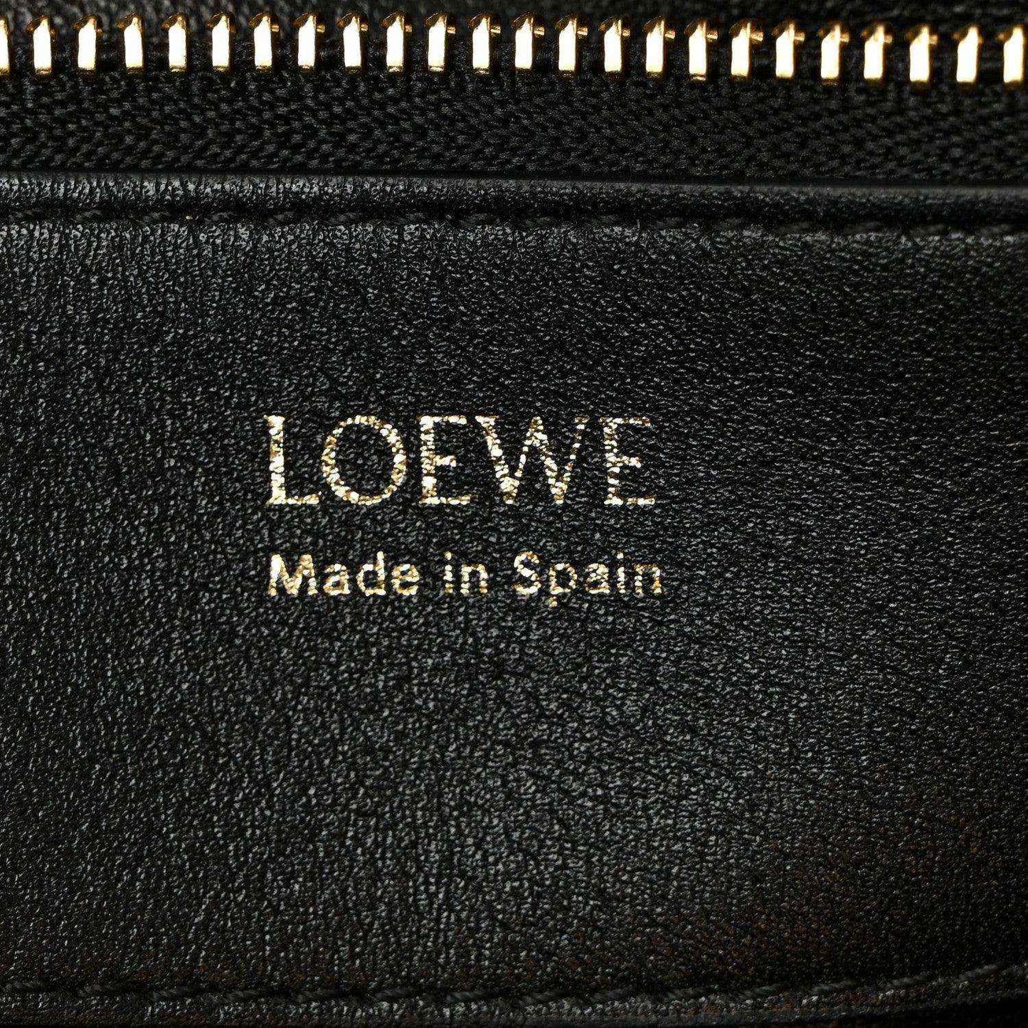 Loewe leather label on black lining reading 'Made in Spain'.