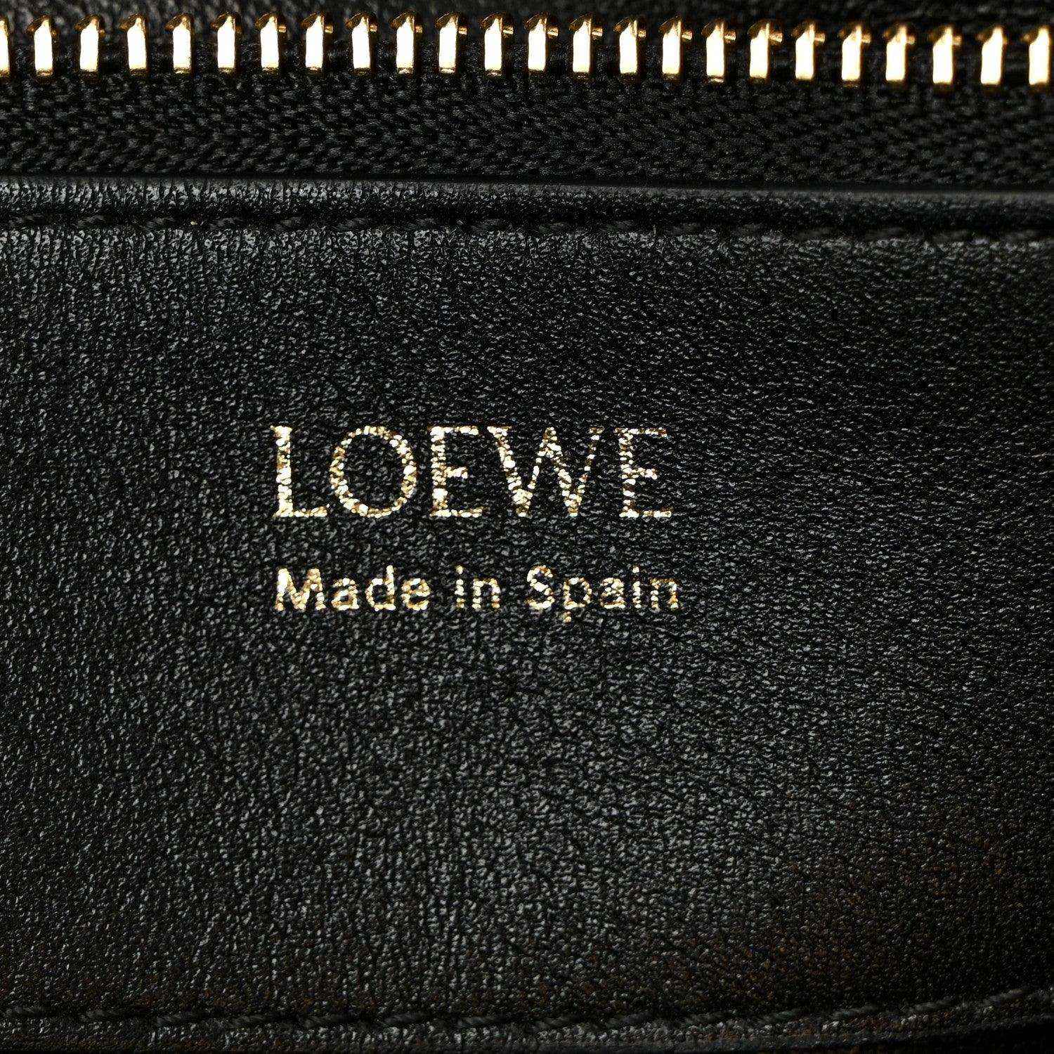 Loewe leather label on black lining reading 'Made in Spain'.