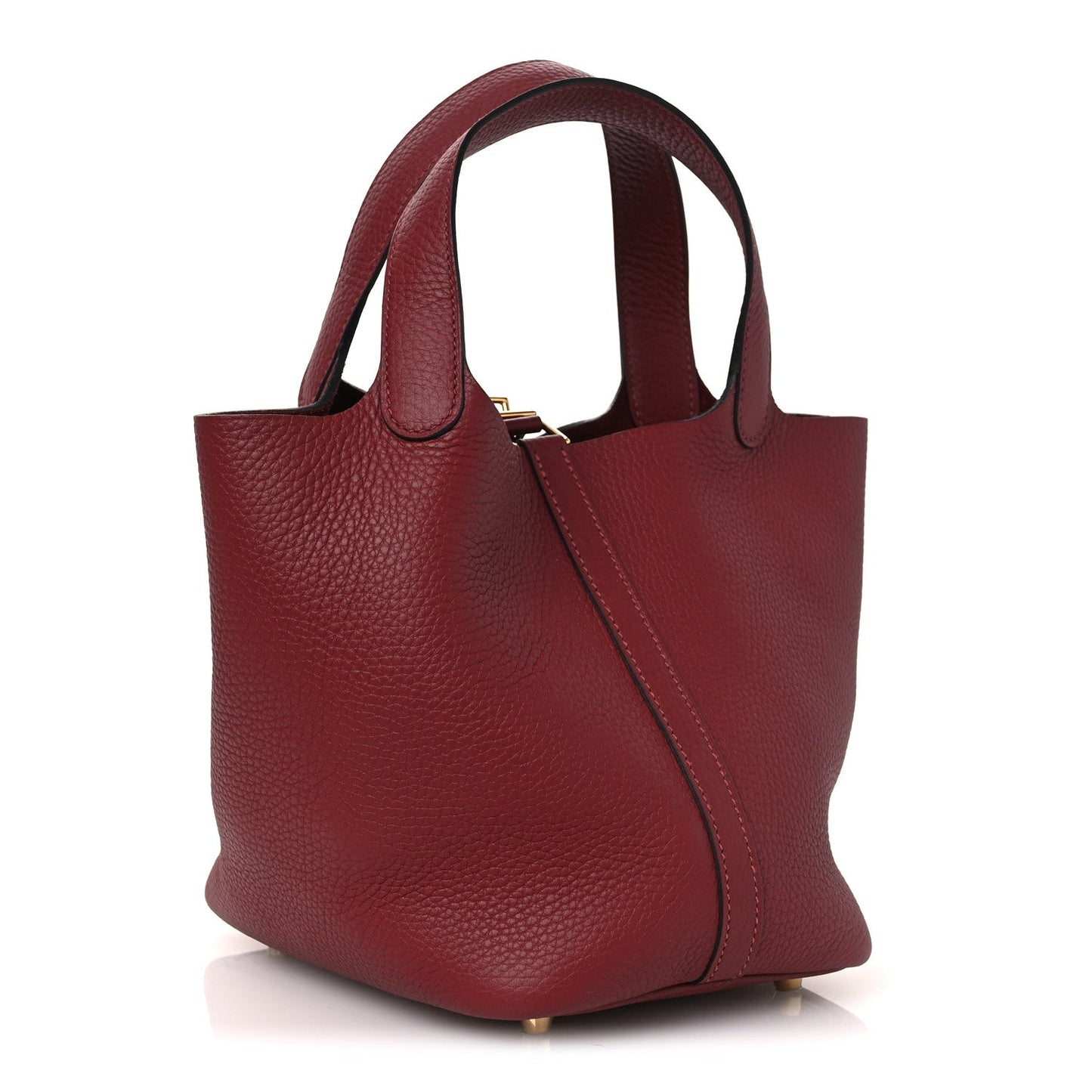 Grained leather tote bag with two rolled handles, burgundy red, gold clasp at top