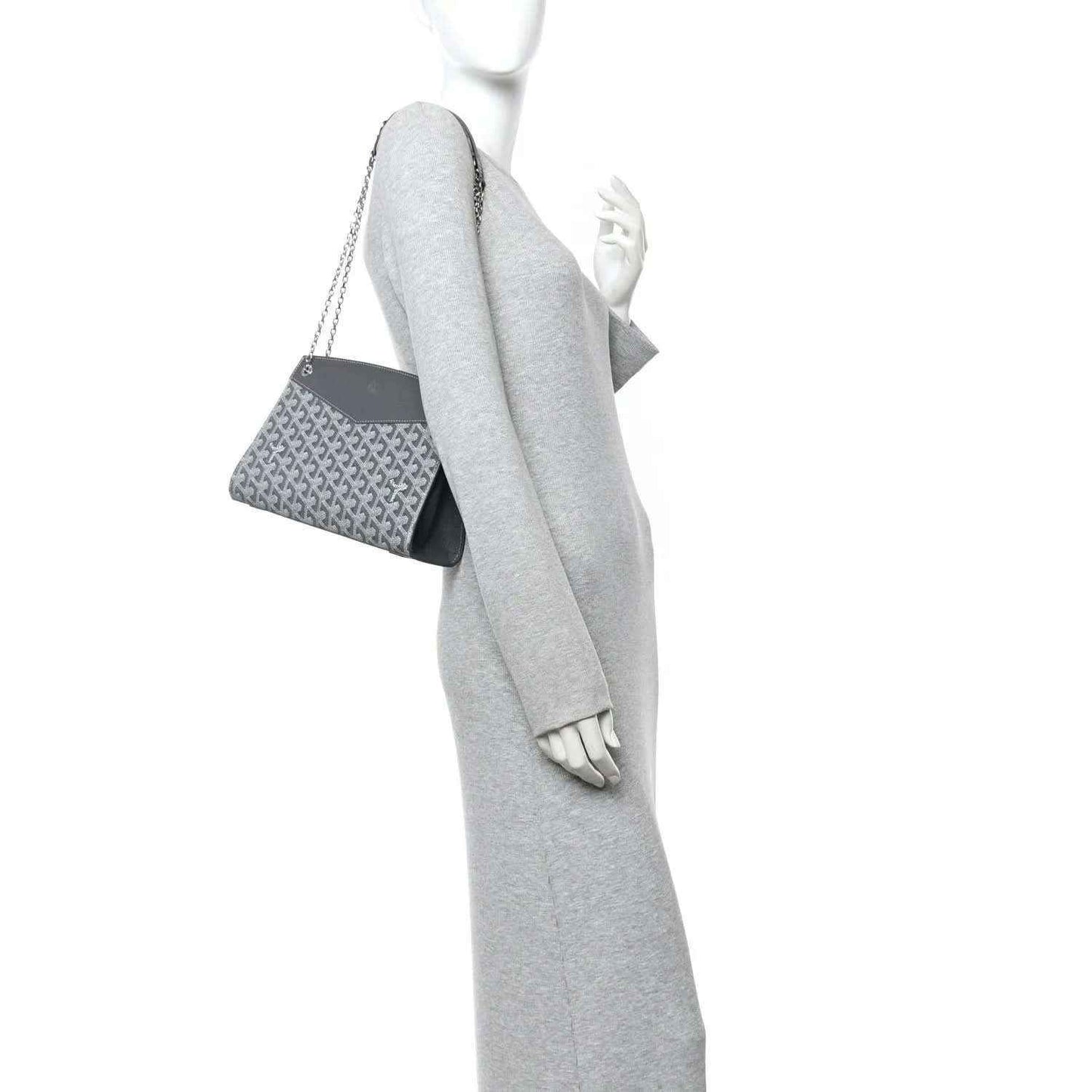 Grey shoulder bag with monogram panel and short top strap, shown in side view