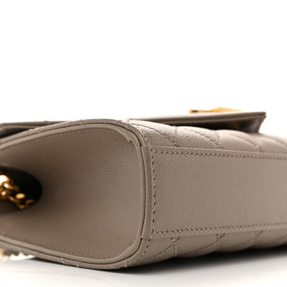 Grain-textured satchel base with rounded corner and stitching