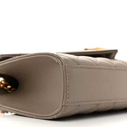 Grain-textured satchel base with rounded corner and stitching