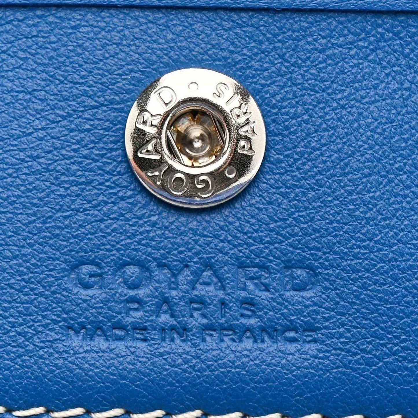 Mini reversible tote bag, round metal clasp on blue leather with engraved Goyard