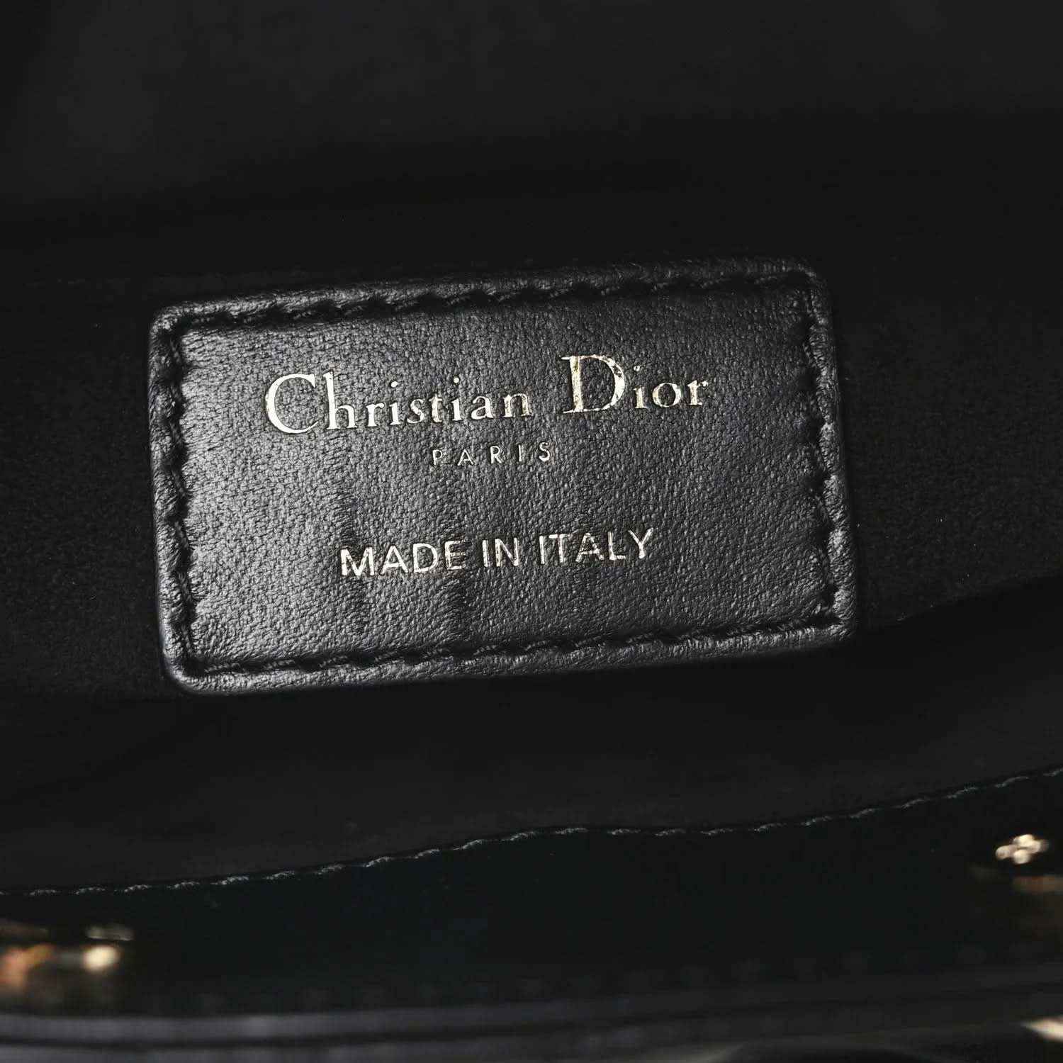 Black leather interior label reading Christian Dior and Made in Italy