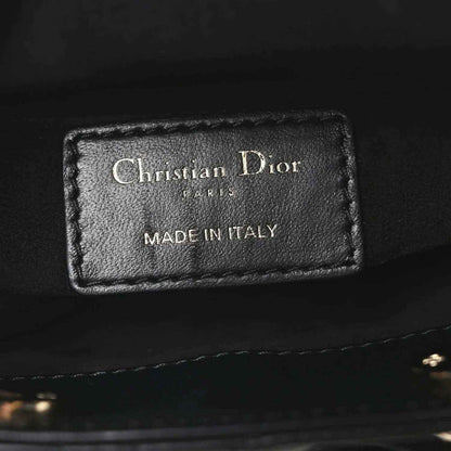 Black leather interior label reading Christian Dior and Made in Italy