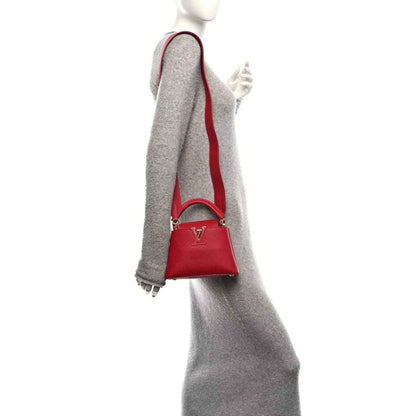 Louis Vuitton scarlet leather mini handbag with adjustable strap and gold-tone clasp
