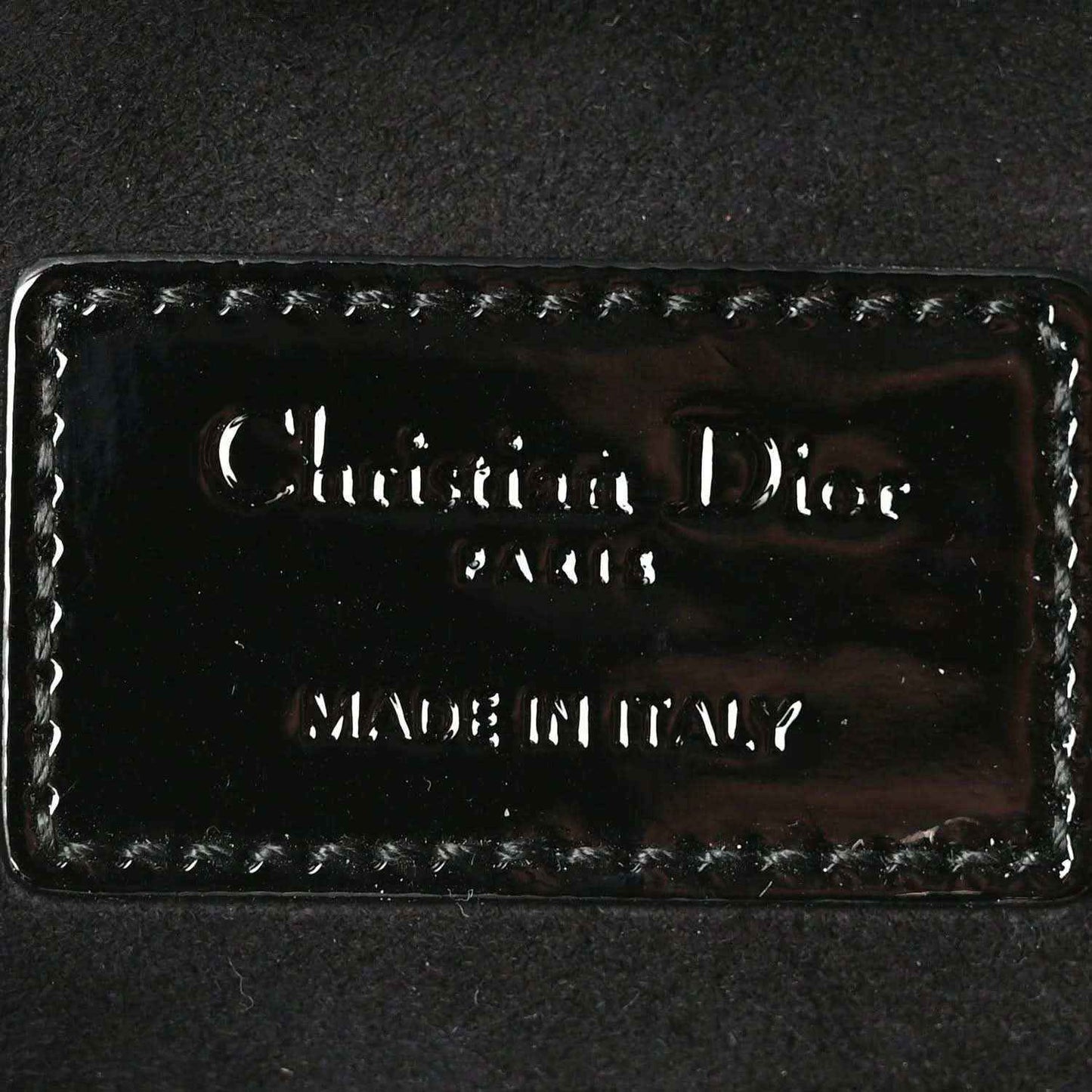 Christian Dior logo patch on black patent leather lining
