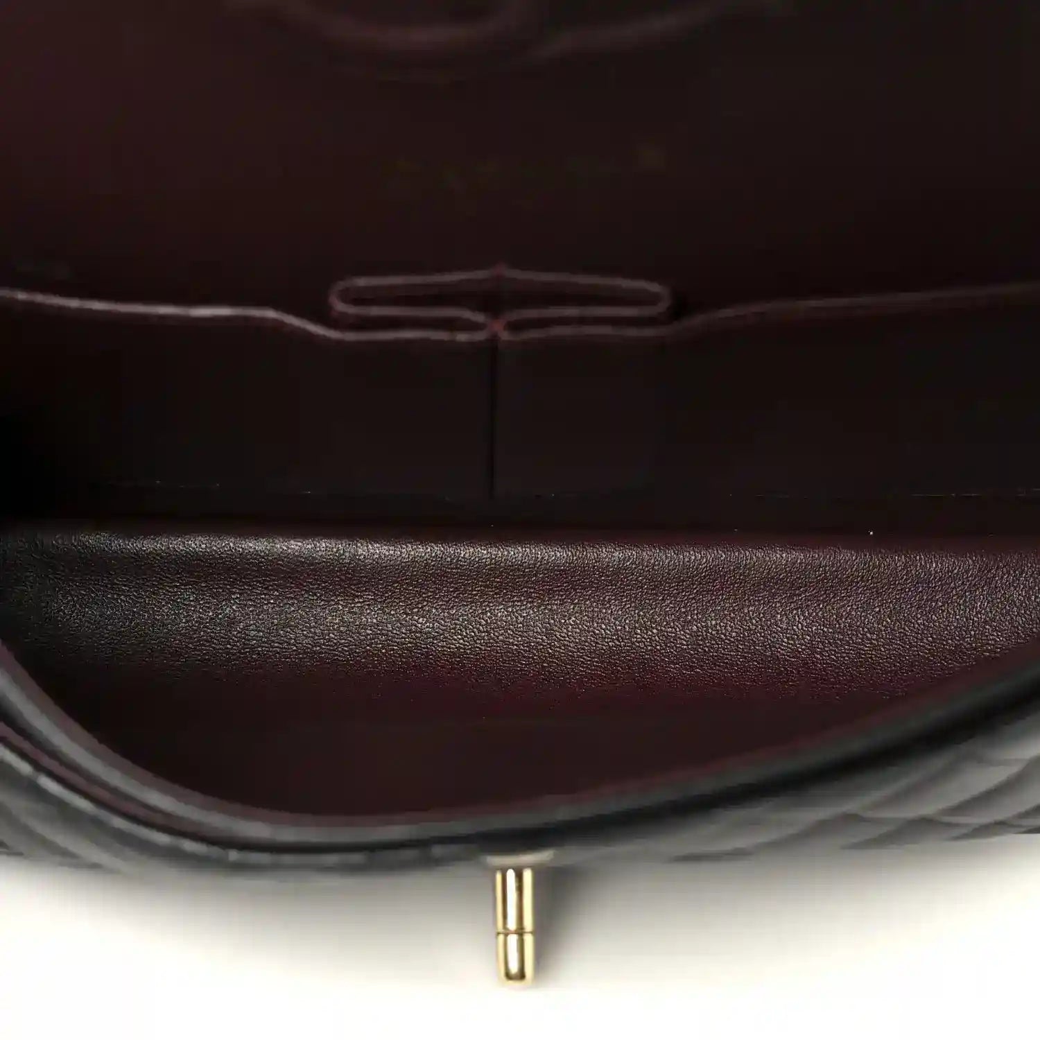 Chanel lambskin interior lining close-up in dark red with center seam