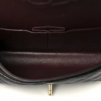 Chanel lambskin interior lining close-up in dark red with center seam