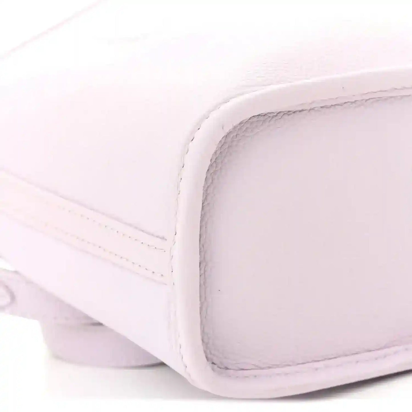 Lilac BB bag corner with smooth leather-like texture and stitched edging
