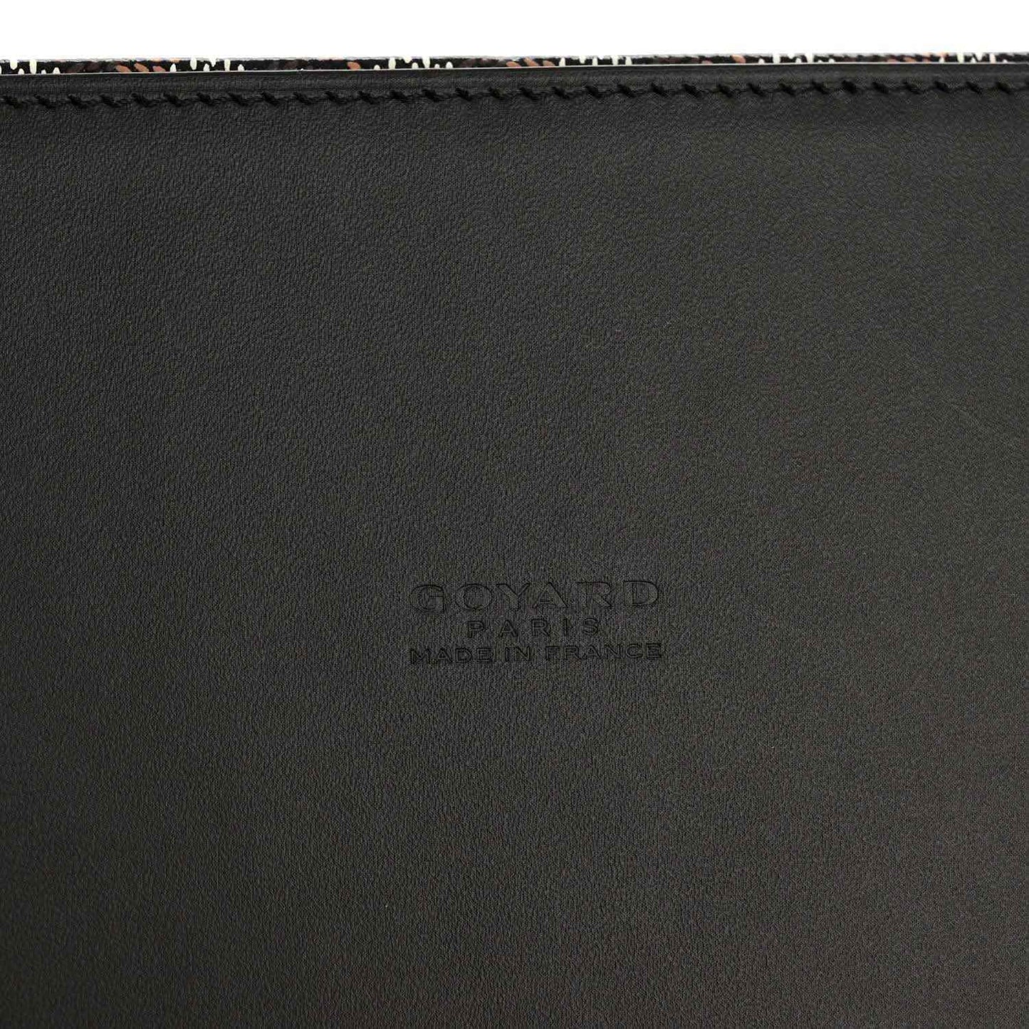 Black leather panel detail with subtle embossed Goyard branding