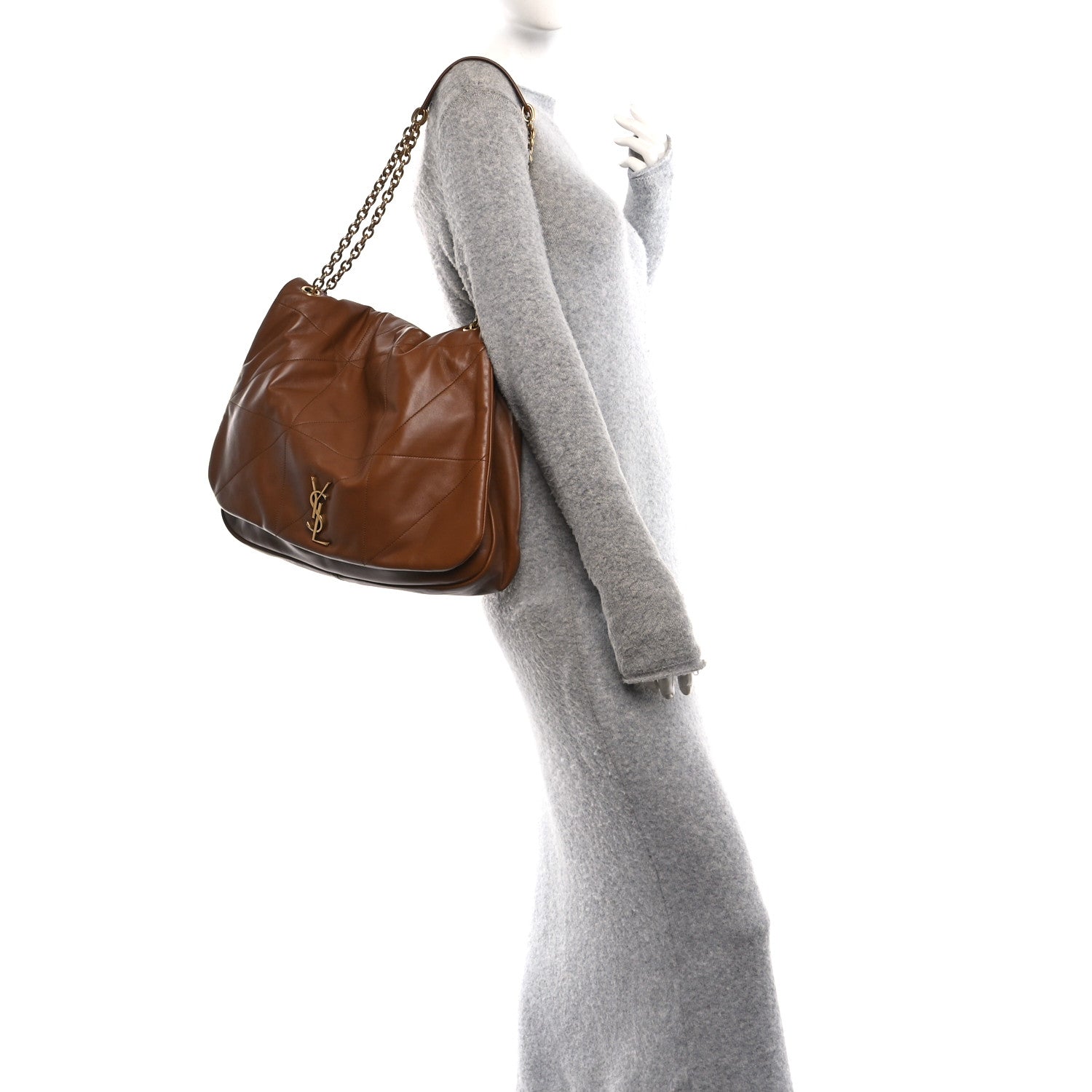 Tan-brown leather small shoulder bag with short chain strap, curved flap.