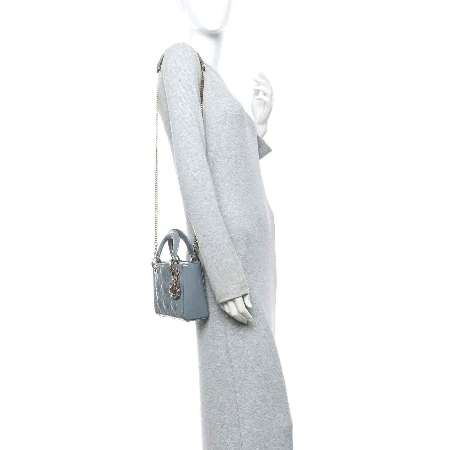 Light blue mini Lady Dior bag worn on a shoulder with chain strap