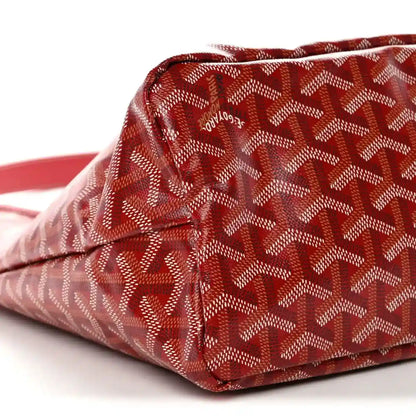 Red Goyardine hobo bag corner with monogram pattern and stitched seam