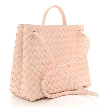 Pink intrecciato leather medium tote bag with top handles, angled view