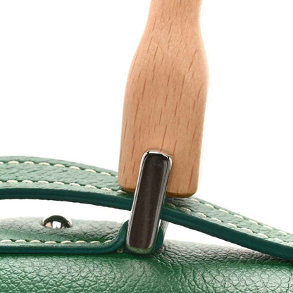 Mini Saigon bag handle attachment with green leather trim and metal ring