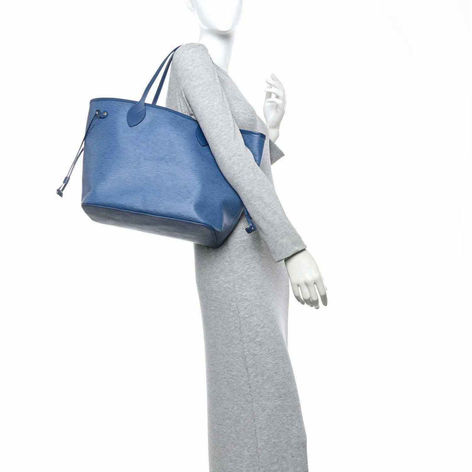 Denim blue leather tote bag with matching small pouch and adjustable shoulder strap