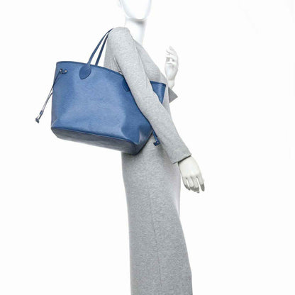Denim blue leather tote bag with matching small pouch and adjustable shoulder strap