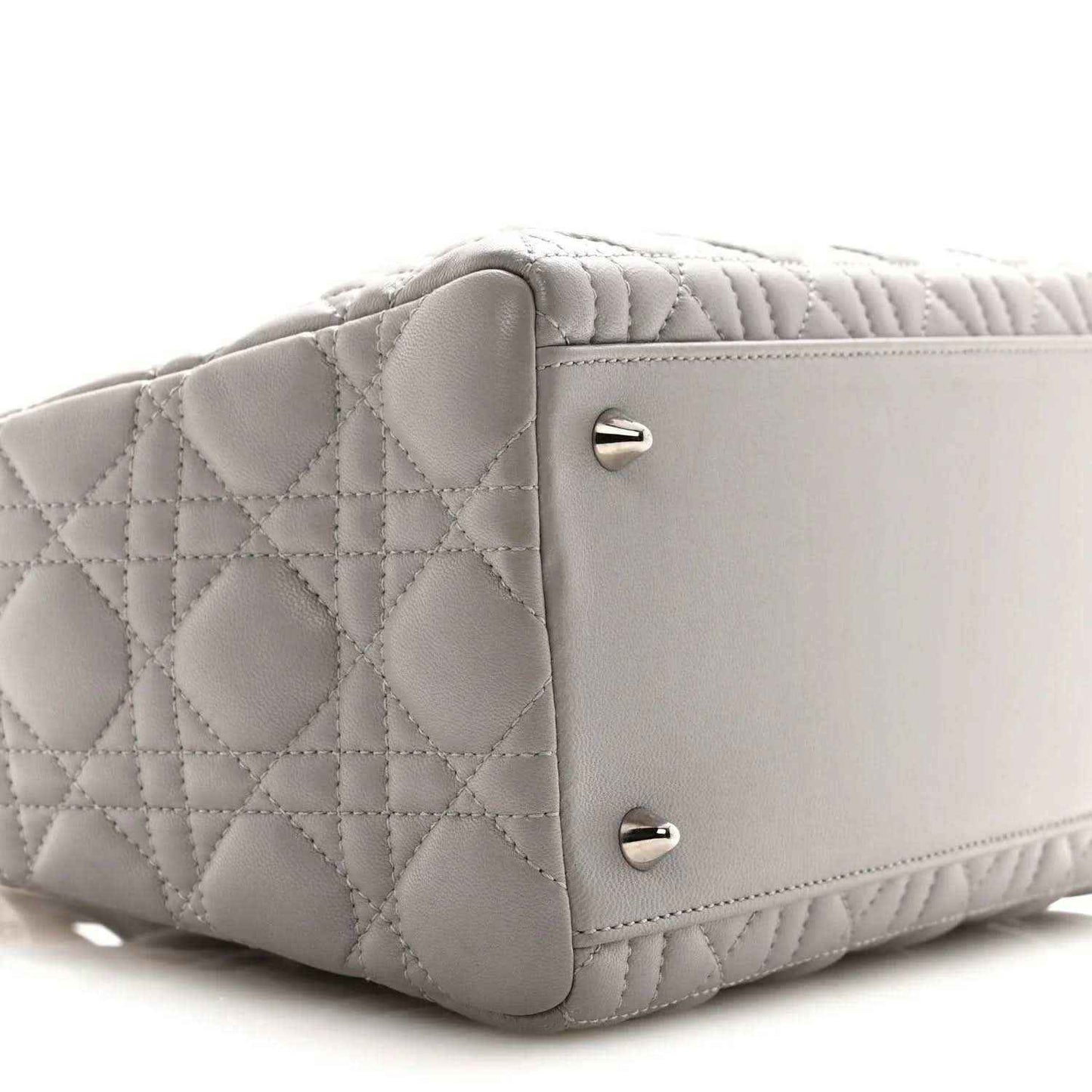 Grey quilted Lady Dior medium handbag side view with front flap hardware