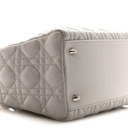 Grey quilted Lady Dior medium handbag side view with front flap hardware