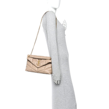 Saint Laurent quilted small Loulou satchel with chain strap, worn crossbody, dark beige