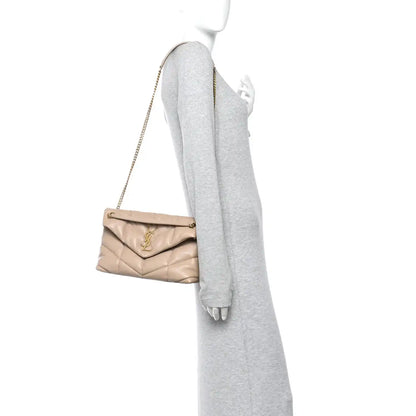 Saint Laurent quilted small Loulou satchel with chain strap, worn crossbody, dark beige