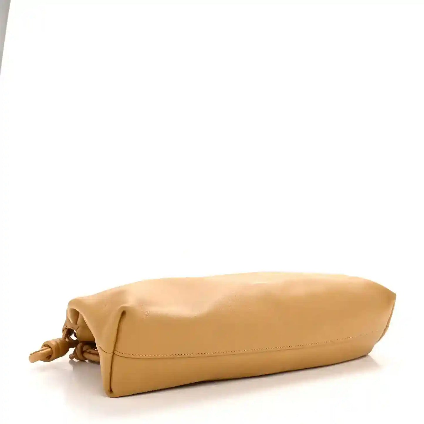Tan leather clutch laid on side with short chain-top hardware