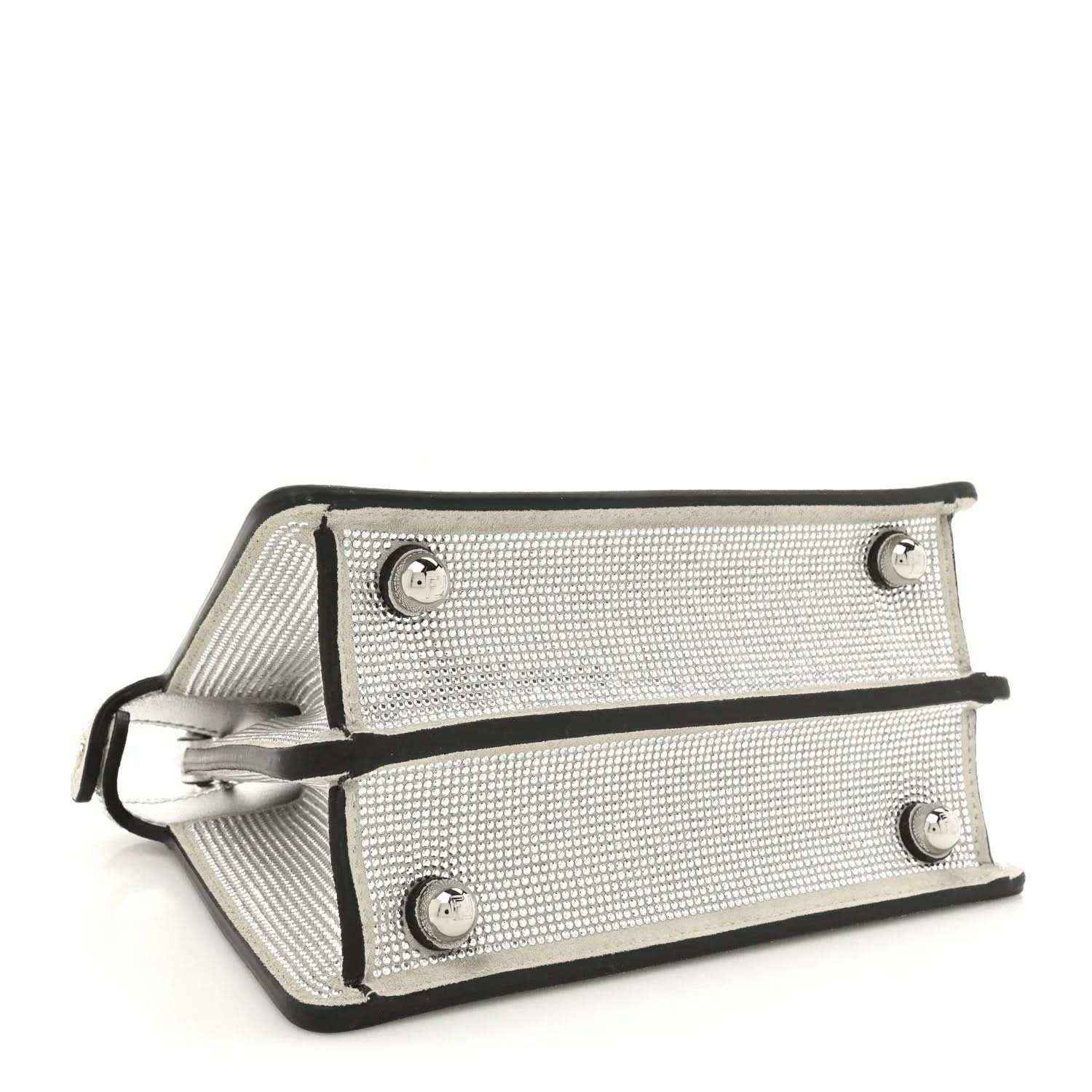 Crystal-embellished satchel with detachable shoulder strap and metal feet, silver tone.