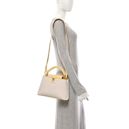 Louis Vuitton Capucines BB handbag on model, small structured bag with short handle