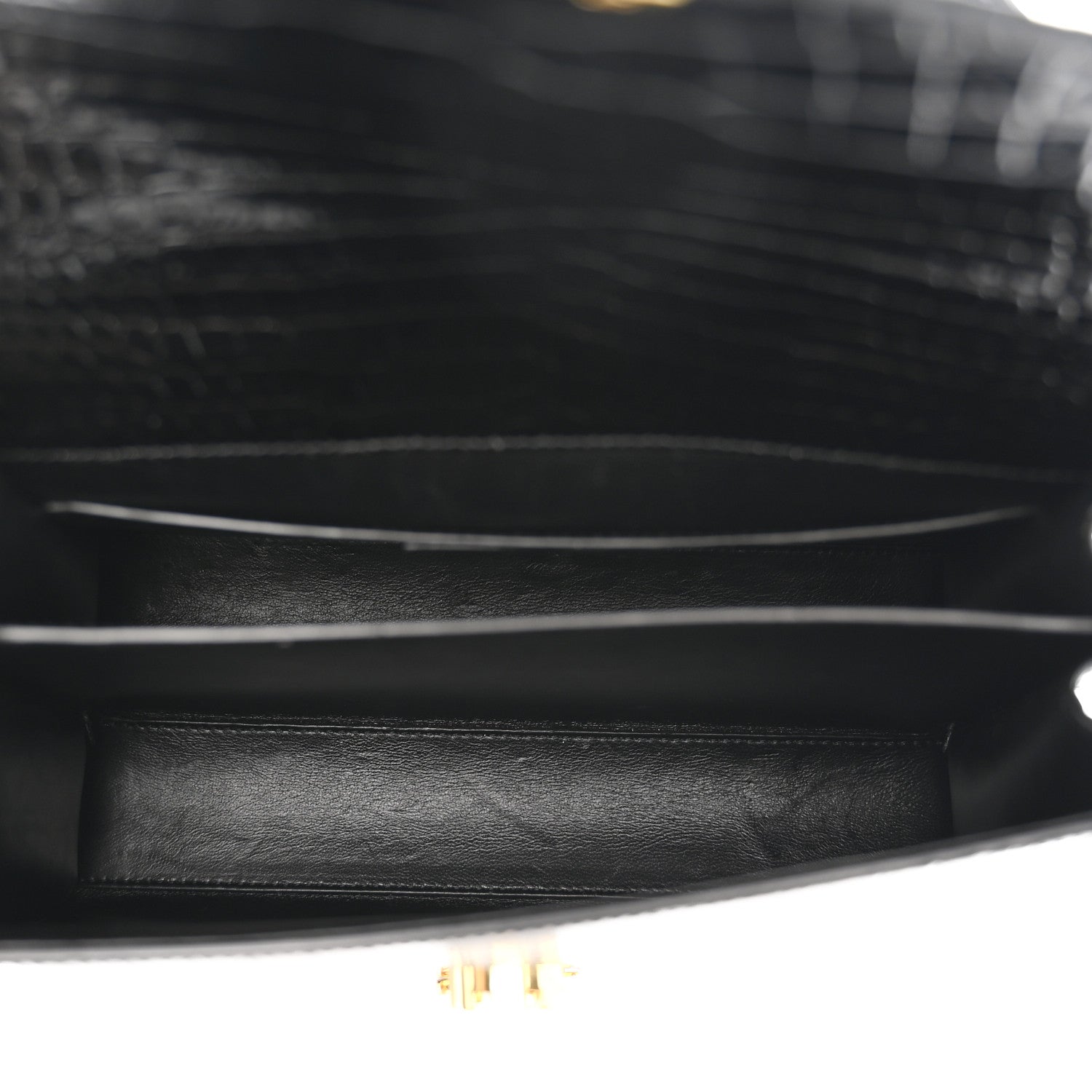 Black leather interior with gold-toned hardware and trim edge