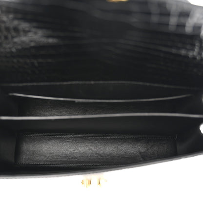 Black leather interior with gold-toned hardware and trim edge