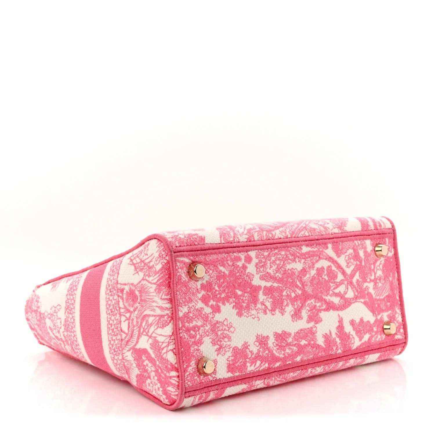 Pink and white patterned tote bag with top handles and side profile, gold hardware