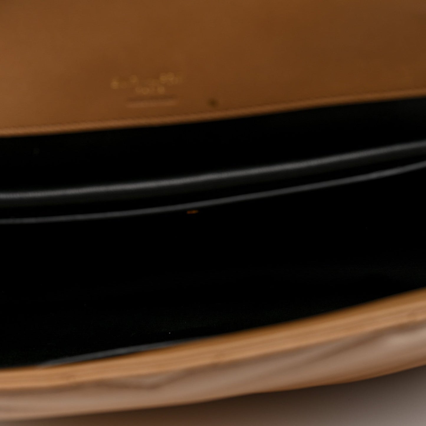 Natural tan leather edge of a bag in close-up