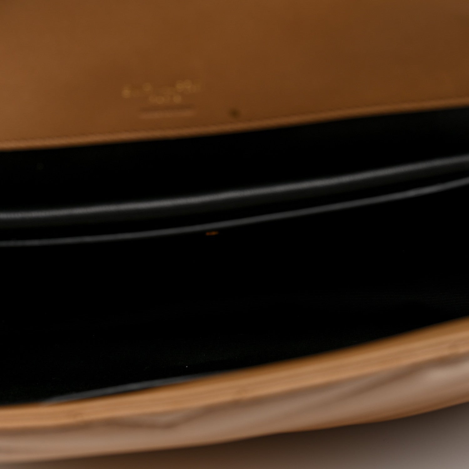 Natural tan leather edge of a bag in close-up