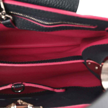 Louis Vuitton Capucines PM bag interior lining, fuchsia fabric with black leather trim and zipper