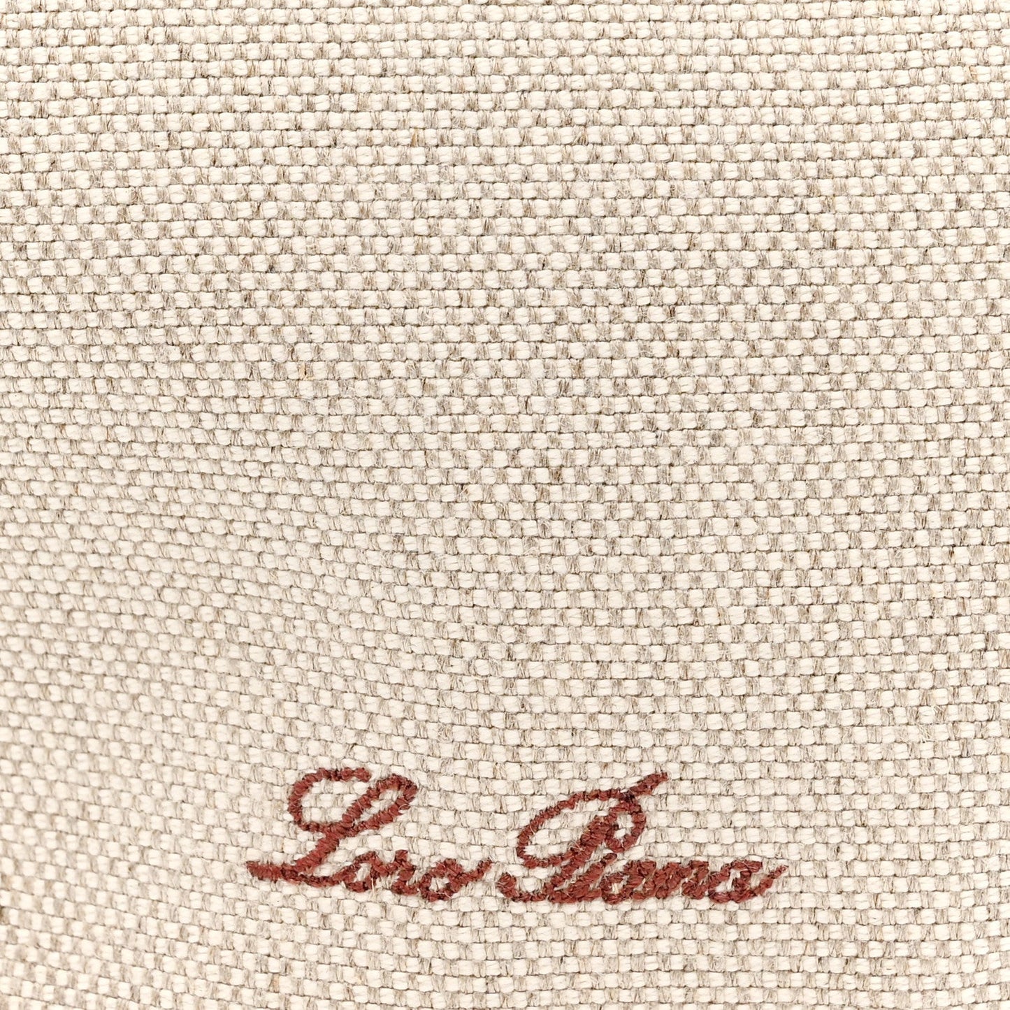 Natural canvas fabric with red-brown Loro Piana logo embroidery.
