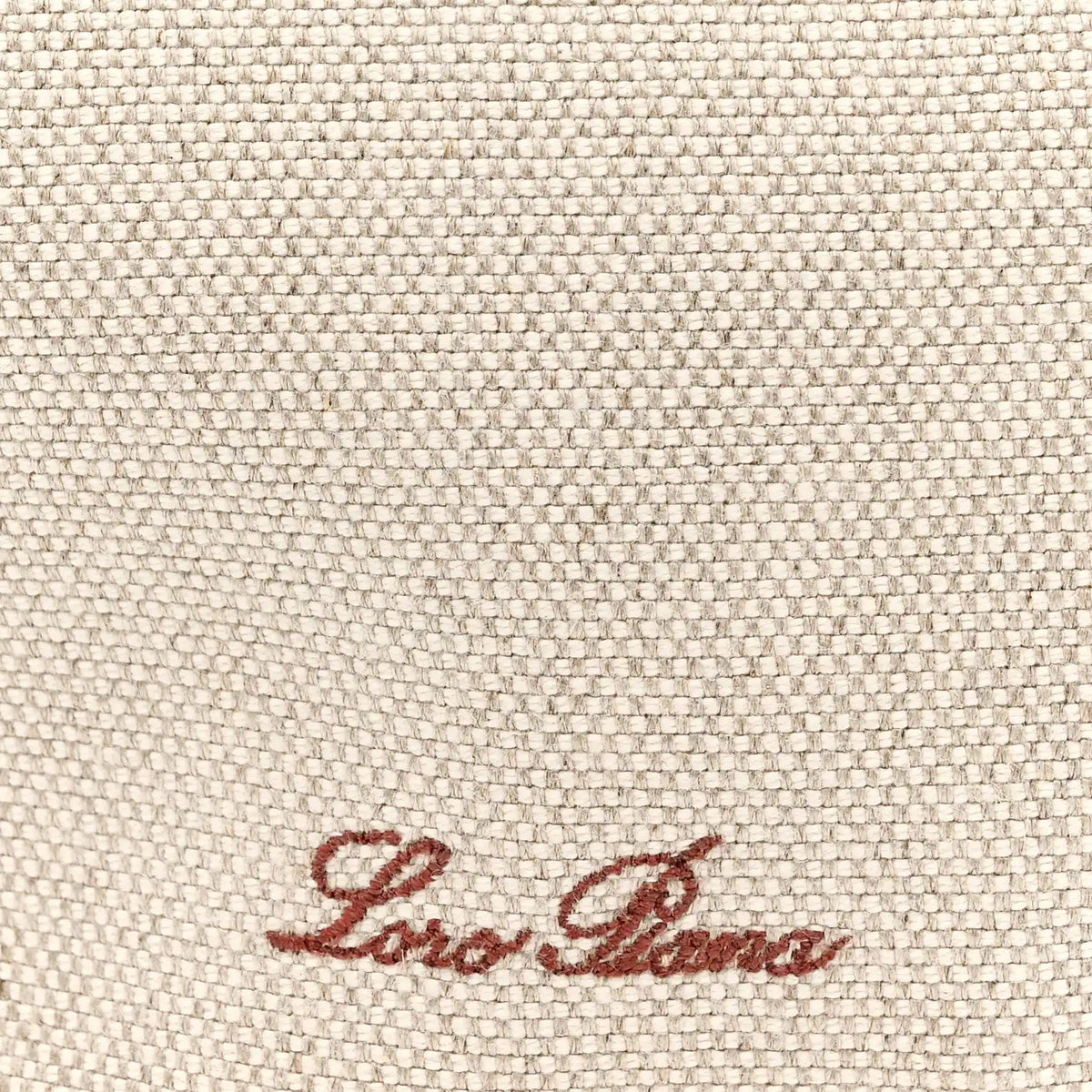 Natural canvas fabric with red-brown Loro Piana logo embroidery.