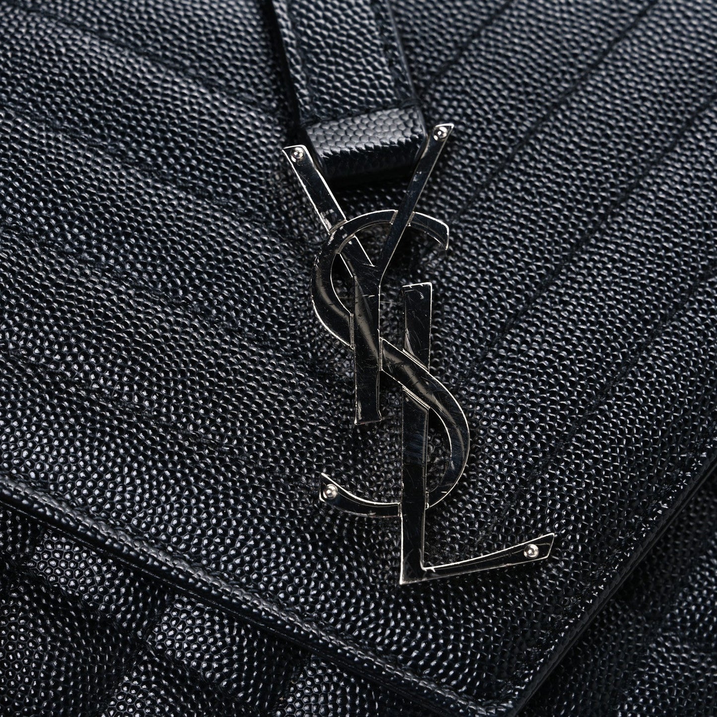 Black textured leather satchel front with metal YSL monogram hardware