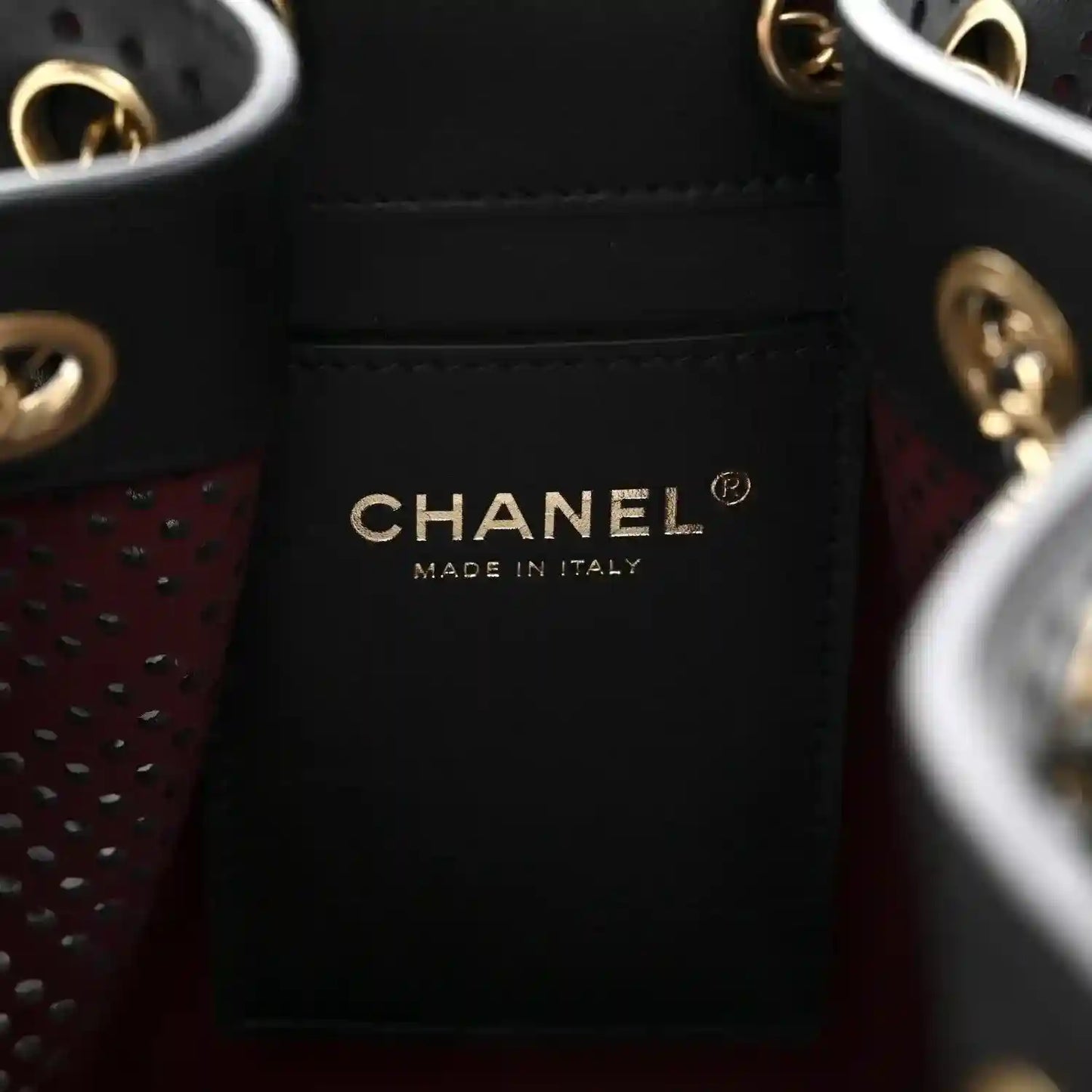 Chanel interior label reading CHANEL MADE IN ITALY on black lining