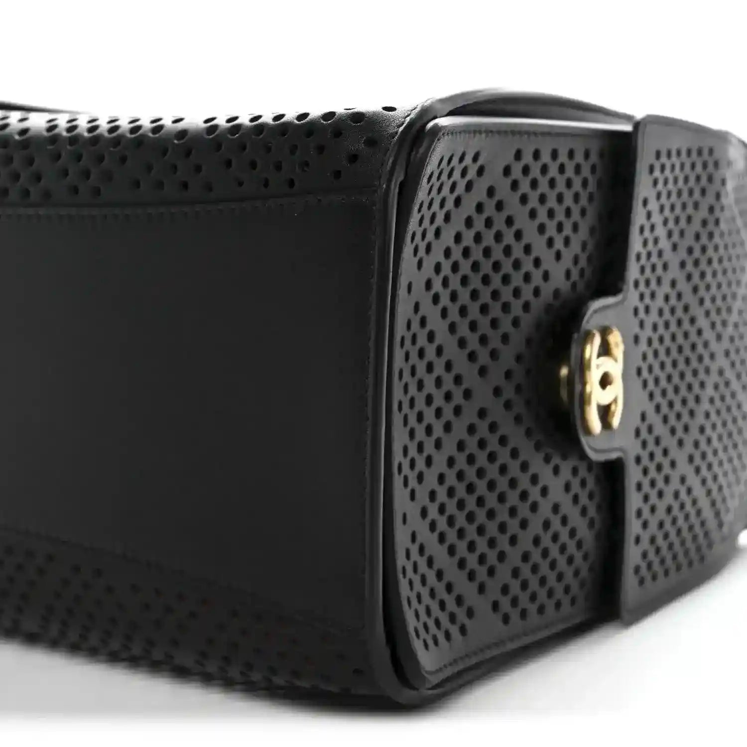 Chanel handbag with black perforated calfskin panels and gold clasp hardware